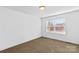 Bedroom featuring neutral carpeting and a large window at 451 Lookout Dam Rd, Statesville, NC 28625