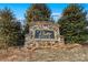 Stone entrance sign for River Rock community amid lush landscaping at 451 Lookout Dam Rd, Statesville, NC 28625