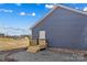 Side view shows the home's siding and a small wooden deck to the back door at 451 Lookout Dam Rd, Statesville, NC 28625