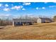 Rear view of two homes demonstrating their proximity in an undeveloped lot at 451 Lookout Dam Rd, Statesville, NC 28625