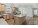 Modern kitchen boasting stainless steel appliances, an island, and ample counter space at 451 Lookout Dam Rd, Statesville, NC 28625
