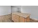 Spacious kitchen island boasts granite countertops, wooden cabinetry, and ample storage space at 451 Lookout Dam Rd, Statesville, NC 28625