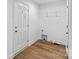 Utility room featuring vinyl flooring, hookups, and a wire rack at 451 Lookout Dam Rd, Statesville, NC 28625