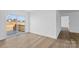 Bright living room featuring sliding glass doors leading to an outdoor deck at 451 Lookout Dam Rd, Statesville, NC 28625
