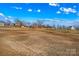 Expansive lot featuring an open field, showcasing the property's considerable size at 451 Lookout Dam Rd, Statesville, NC 28625