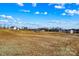 View of the property's large, undeveloped lot with other homes in the distance at 451 Lookout Dam Rd, Statesville, NC 28625