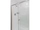 Modern bathroom shower with glass door and white tile surround at 451 Lookout Dam Rd, Statesville, NC 28625