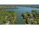Aerial view of the lakefront property with multiple docks and lush green surroundings at 4786 Heather Ln, Denver, NC 28037
