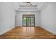 Spacious bedroom with lake views, tray ceiling, and hardwood floors at 4786 Heather Ln, Denver, NC 28037