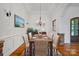 Elegant dining room with a modern chandelier and seating for six at 4786 Heather Ln, Denver, NC 28037