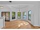 Dining room boasts lake views through large windows and access to the outdoor terrace at 4786 Heather Ln, Denver, NC 28037
