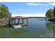 Private boat dock featuring covered moorage and sunny sky at 4786 Heather Ln, Denver, NC 28037
