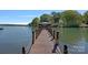 Waterfront property featuring a private dock with a covered gazebo and stunning lake views at 4786 Heather Ln, Denver, NC 28037