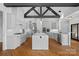 Gourmet kitchen with an oversized marble island, stainless appliances, and plenty of storage at 4786 Heather Ln, Denver, NC 28037