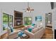 Cozy living room with a stone fireplace, comfortable seating, and lake views at 4786 Heather Ln, Denver, NC 28037