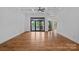 Open living room with a lake view, hardwood floors, and coffered ceilings at 4786 Heather Ln, Denver, NC 28037