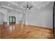 Spacious living room with hardwood floors, coffered ceilings, and natural light at 4786 Heather Ln, Denver, NC 28037