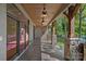 Covered patio with stone pillars, multiple ceiling fans, and stunning lake views at 4786 Heather Ln, Denver, NC 28037