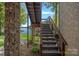 Exterior stairs leading to a lakefront gazebo offering beautiful water views at 4786 Heather Ln, Denver, NC 28037