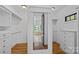 Large walk-in closet featuring built-in shelving and storage solutions at 4786 Heather Ln, Denver, NC 28037