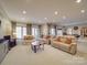 Finished basement with ample seating, recessed lighting, and neutral colors at 503 Stuart Rdg, Cramerton, NC 28032