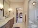 Well-lit bathroom with double vanity, marble countertop, and access to bunk room at 503 Stuart Rdg, Cramerton, NC 28032