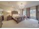 Elegant bedroom with a large bed, stylish lighting and natural light at 503 Stuart Rdg, Cramerton, NC 28032