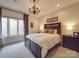 Comfortable bedroom with large window, plush carpet, and a chandelier at 503 Stuart Rdg, Cramerton, NC 28032