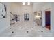 Grand foyer featuring high ceilings, staircase, tile flooring, chandelier and lots of natural light at 503 Stuart Rdg, Cramerton, NC 28032
