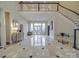 Grand foyer featuring high ceilings, a staircase, and marble flooring at 503 Stuart Rdg, Cramerton, NC 28032