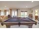 Spacious game room with pool table and access to the outdoors at 503 Stuart Rdg, Cramerton, NC 28032
