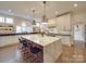 Modern kitchen featuring a large marble island, stainless steel appliances, and pendant lighting at 503 Stuart Rdg, Cramerton, NC 28032