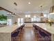Spacious open kitchen with dual islands, modern lighting, barstool seating and hardwood floors at 503 Stuart Rdg, Cramerton, NC 28032