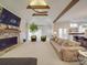 Open-concept living room with vaulted ceilings, beams, fireplace, and views to the kitchen at 503 Stuart Rdg, Cramerton, NC 28032