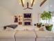 Vaulted living room featuring stone fireplace, beamed ceilings, and lots of natural light at 503 Stuart Rdg, Cramerton, NC 28032