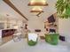 Open-concept living room and kitchen area with vaulted ceilings, beam, fireplace, and stylish decor at 503 Stuart Rdg, Cramerton, NC 28032