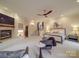 Spacious primary bedroom featuring a cozy sitting area, fireplace, and elegant decor at 503 Stuart Rdg, Cramerton, NC 28032