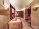 Elegant wine cellar featuring brick-laid floors, leather furniture, a custom wine rack, and ambient lighting at 503 Stuart Rdg, Cramerton, NC 28032