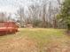 Large backyard with a shed, offering plenty of space for outdoor activities and storage at 608 E Matthews St, Matthews, NC 28105
