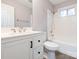 Bathroom features updated vanity, mirror, shower, and white tile at 608 E Matthews St, Matthews, NC 28105