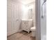 Bathroom featuring white vanity, toilet, and shower with new gray walls and plank floors at 608 E Matthews St, Matthews, NC 28105