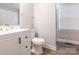 Bathroom featuring white vanity with black hardware, with a toilet and large mirror at 608 E Matthews St, Matthews, NC 28105