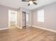 Spacious bedroom boasts a closet, neutral paint, and lots of natural light at 608 E Matthews St, Matthews, NC 28105