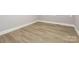 A vacant bedroom with freshly painted walls and baseboards with modern flooring at 608 E Matthews St, Matthews, NC 28105