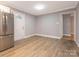 Open-concept living room with fresh paint and modern flooring at 608 E Matthews St, Matthews, NC 28105