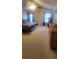 Spacious main bedroom with neutral carpet, ceiling fan, and natural light, great for comfort at 6237 Shelley Ave, Charlotte, NC 28269