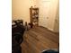 Functional home office features wood-look floors and a built-in bookcase for ample storage at 6237 Shelley Ave, Charlotte, NC 28269