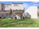 View of the backyard, showcasing a green lawn and the exterior of the home at 9724 Walkers Glen Nw Dr, Concord, NC 28027