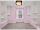 Charming bedroom featuring custom shelving and a stylish light fixture at 9724 Walkers Glen Nw Dr, Concord, NC 28027
