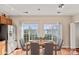 Cozy dining area with natural light, modern decor, and hardwood floors at 9724 Walkers Glen Nw Dr, Concord, NC 28027
